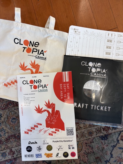 Clonetopia tote bag, event flyer and craft kit featuring orange and black cannabis-themed artwork.